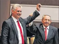  ?? PRENSA LATINA ?? The Cuban Parliament elected Miguel Diaz-Canel, left, as president of the State Council for a term of five years, the National Electoral Commission announced in Havana April 19. He replaces Raul Castro, (shown offering his support) and brother of...