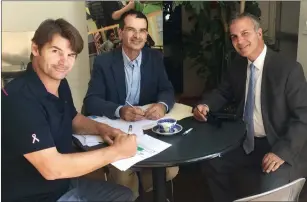  ?? Submitted photo ?? Left to right, Gamm Managing Director Oliver Dow; Stephen Soscia of Mutual Property Associates; and Gamm Board of Directors President Leon C. Boghossian III sign a lease for the Gamm’s new home on Jefferson Boulevard in Warwick.