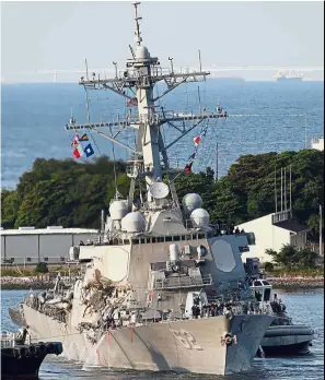  ?? — Reuters ?? Badly damaged: The ‘USS Fitzgerald’ being towed to port at the US naval base in Yokosuka.