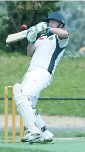  ??  ?? Garfield-Tynong’s Tom Bulenok is tested with both wide and short ball during the division three match against Bunyip.