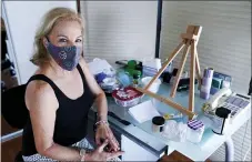  ?? LYNNE SLADKY — THE ASSOCIATED PRESS ?? Artist Irene Pressner of Aventura, Fla. The Venezuelan artist, a COVID-19 survivor who lost her husband to the virus, is creating new works inspired by her experience.