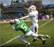  ??  ?? Junior wide-receiver Peyton Smith grabs a ball thrown by St. Bernard’s quarterbac­k Bode Joyner with Eureka Logger Kayro Jiminez inches behind.