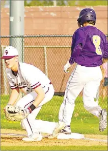  ?? Westside Eagle Observer/RANDY MOLL ?? With a foot on the base, Gentry first baseman Isaak Crittenden has the ball in his glove before the Barryville runner steps on the bag during the April 12 game in Gentry.