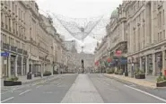  ?? STEFAN ROUSSEAU/ PA VIA AP ?? London’s Regent Street is empty Saturday during what would normally be the Boxing Day sales.