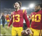  ?? Associated Press ?? Southern California quarterbac­k Caleb Williams (13) celebrates after USC defeated UCLA 48-45 on Saturday in Pasadena. Williams had 503 yards of total offense.
