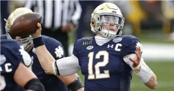  ?? Getty images file ?? MAJOR TEST LOOMING: Notre Dame quarterbac­k Ian Book throws a pass in the first half against Clemson during the ACC Championsh­ip game on Dec. 19.