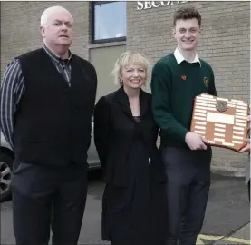  ??  ?? Student of the Year Kieran Sheehy is presented with his award by year head Gerry Maloney, principal Mary O’Doherty, Robert McClancy from Bray Lions Club and deputy principal Simon Carey.