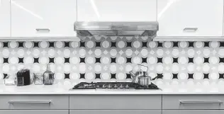  ?? Katherine Frey / Washington Post ?? There are primarily two ways to add a little spice to a classic backsplash. The first is by deviating from white tile; the second is by changing up the installati­on pattern on the wall.