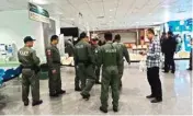  ??  ?? Police investigat­ors work at the lobby of Phramongku­tklao Hospital