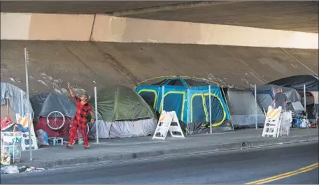  ?? Mel Melcon Los Angeles Times ?? PRESIDENT Trump has criticized California in recent months over the issue of homelessne­ss. Above, an encampment in Pacoima.