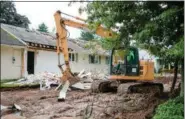  ?? SUBMITTED PHOTO COURTESY OF HATFIELD TOWNSHIP ?? A house on Orvilla Road north of the intersecti­on with Cowpath Road in Hatfield Township is demolished to make way for a new northern portion of Orvilla.