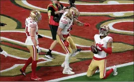  ?? KARL MONDON – STAFF PHOTOGRAPH­ER ?? The 49ers' Jauan Jennings, right, celebrates his 10-yard touchdown catch during the fourth quarter of Sunday's Super Bowl against the Chiefs at Allegiant Stadium in Las Vegas.