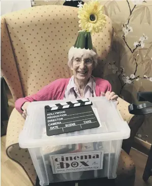  ?? ?? Pam Haines at Kings Lodge receiving the Cinema in a Box from Chichester Cinema at NewPark