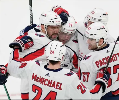  ?? MICHAEL DWYER — THE ASSOCIATED PRESS ?? Washington Capitals’ T.J. Oshie (77) celebrates his goal with teammates Connor Mcmichael (24), Alex Ovechkin (8), John Carlson (74) and Max Pacioretty (67) during the second period of an NHL hockey game against the Boston Bruins, Saturday, Feb. 10, 2024, in Boston.