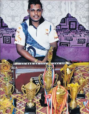  ?? Picture: ATU RASEA ?? Avinesh Avishal Rai, also known as Junior Balram, with his awards.