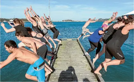  ?? PHOTO: SUPPLIED/DAVE ALLEN ?? Wellington Niwa staff leap off the Evans Bay pier to celebrate the shortest day of the year.