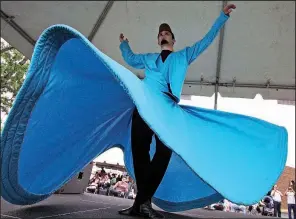  ?? Arkansas Democrat-Gazette/MITCHELL PE MASILUN ?? Whirling Dervish Onur Kasaburi performs at last year’s Turkish Food Festival. This year’s festival of food, arts and crafts and performanc­es is planned for Saturday at the Raindrop Turkish House.