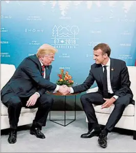  ?? LUDOVIC MARIN/GETTY-AFP ?? President Donald Trump and French President Emmanuel Macron hold a meeting Friday on the sidelines of the G-7 summit in Charlevoix, Quebec. The summit ends Saturday.