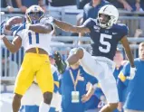  ?? BARRY REEGER/AP ?? Pitt converted 4 of 9 attempts on third-and-9 or longer against Penn State. Receiver Taysir Mack, left, against Penn State cornerback Tariq Castro-Fields, was a big part of that.