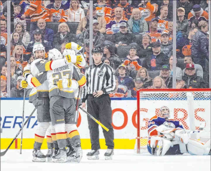  ?? Jason Franson
The Canadian Press via AP ?? The Golden Knights celebrate Saturday night after Nicolas Roy faked out Oilers goalie Stuart Skinner to score the overtime game-winner at Rogers Place in Edmonton.