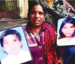  ?? ?? Neetu Kumari with photos of her missing children.