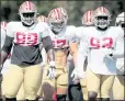  ?? ANDA CHU — STAFF PHOTOGRAPH­ER ?? 49ers defensive linemen, from left, Javon Kinlaw, Nick Bosa and Zach Kerr transition between drills during a training camp workout in Santa Clara.