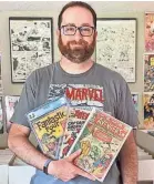  ?? COURTESY OF CHRISSY MEYERS ?? Aaron Meyers, who buys and sells comic books, says impulse buying “fills an emotional need” for shoppers.