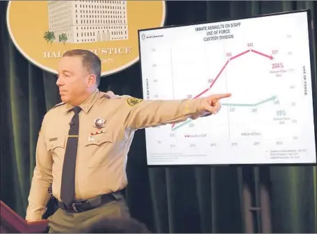  ?? Irfan Khan Los Angeles Times ?? SHERIFF Alex Villanueva uses a chart on Jan. 30 to discuss inmate assaults on staff in the jails. His statistics have come under question.