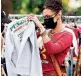  ??  ?? 8. Bella Hadid considers a Punjabi Deli hoodie at the Sidewalk Sale for Social Justice in Brooklyn benefiting the Black Lives Matter movement.