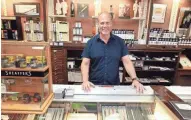  ?? ANGELA PETERSON / MILWAUKEE JOURNAL SENTINEL ?? Brad Bodart, owner of Daly’s Pen Shop, says the store is closing after 93 years in the Milwaukee area. Daly’s sells fine pens that can cost hundreds of dollars.