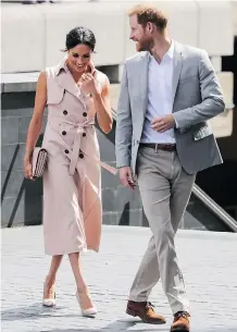  ?? WENN.COM ?? The Duke and Duchess of Sussex in London on Tuesday. Meghan is wearing a sleeveless trench dress by the Calgary brand Nonie.