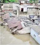  ??  ?? Houses affected by the floods.