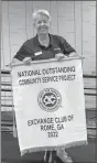  ?? Exchange Club of Rome ?? Exchange Club of Rome Toys for Tots Coordinato­r Linda Hatcher holds up a banner awarded by the National Exchange Club honoring Rome’s Toys for Tots program.