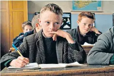  ??  ?? Loaded words: a pupil takes down notes during a language class on the isle of Inishmaan