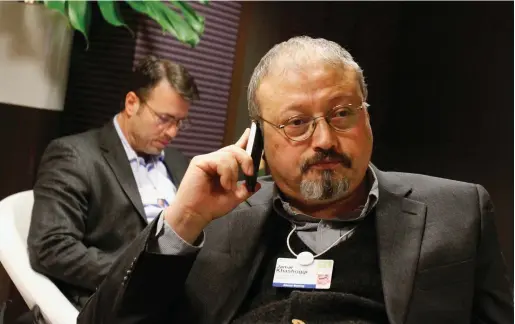  ?? PHOTO: AP/ VIRGINIA MAYO ?? Murdered: Saudi journalist Jamal Khashoggi on his phone at the World Economic Forum in Davos, Switzerlan­d.