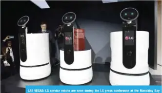  ??  ?? LAS VEGAS: LG service robots are seen during the LG press conference at the Mandalay Bay Convention Center during CES 2018. — AFP