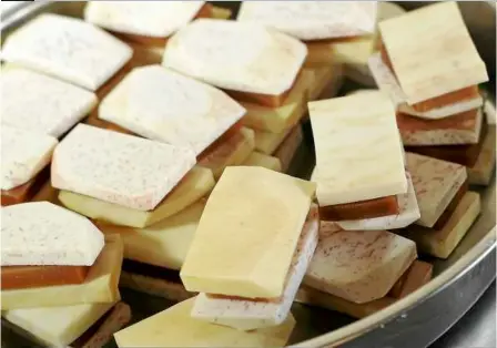  ??  ?? Best stacks: The assembled gold cake ‘burger’ ready for frying. — Photos aZMan GHanI /The Star