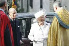  ?? — AFP ?? Queen Elizabeth II and Prince Philip arrive at Westminste­r Abbey on Sunday.