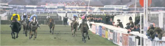  ??  ?? Hywel Davies on Last Suspect (in yellow, far left) gets up to deny Mr Snugfit (far right) in the shadow of the winning post to snatch glory in the 1985 Grand National