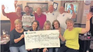  ??  ?? Friends That Do (back row from left) Kev Wilshaw, Sandy Gray, Dave Oakes, Dennis Meszaros and Graham Burgess. Front from left: Lorraine Wilshaw, Ashley Dodd from the Alzheimer’s Society, Lorraine Burgess, Jackie Rycroft and Karen Meszaros