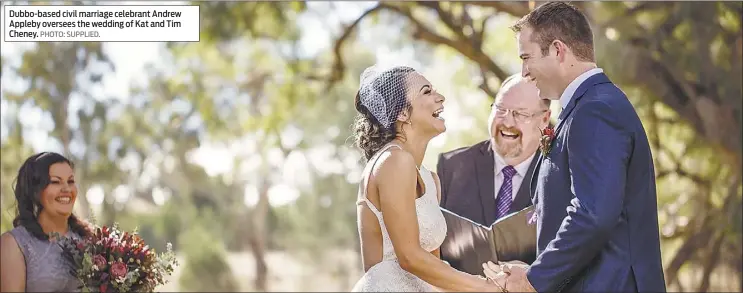  ??  ?? Dubbo-based civil marriage celebrant Andrew Appleby oversees the wedding of Kat and Tim Cheney. PHOTO: SUPPLIED.