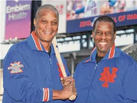  ?? Seth Wenig/Associated Press ?? Former New York Mets Darryl Strawberry, left and Dwight Gooden pose at Citi Field in New York in 2010. Gooden will have his No. 16 jersey retired by the Mets on April 14, while Strawberry will have his No. 18 jersey retired on June 1.