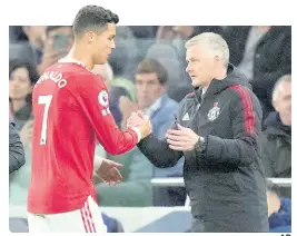  ?? AP ?? Manchester United’s Cristiano Ronaldo (left) greets Manchester United’s manager Ole Gunnar Solskjaer as he is replaced by Marcus Rashford during the English Premier League soccer match against Tottenham Hotspur at the Tottenham Hotspur Stadium in London yesterday. United won 3-0.