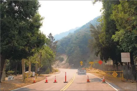  ?? Gabriella Angotti-Jones Los Angeles Times ?? THE ROAD to Mt. Wilson Observator­y is closed Monday as the Bobcat fire continues to burn in Angeles National Forest. The ash that fell across the Southland didn’t just look ominous — one air quality expert notes that the material could contain toxic chemicals.