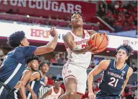  ?? Brett Coomer/Staff photograph­er ?? Preseason All-America guard Marcus Sasser is back for third-ranked University of Houston after missing most of last season with an injury.