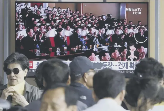  ??  ?? 0 Kim Jong-un, front row third from left, and senior North Korean official Kim Yong Chol, circled, at a performanc­e by the wives of Korean People’s Army officers