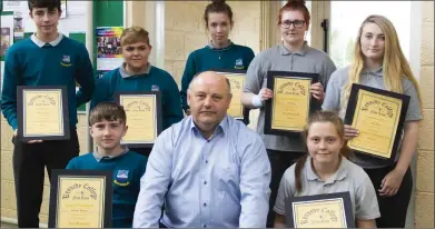  ??  ?? Merit award recipients with vice principal Dominic Hearn.