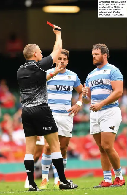  ??  ?? Argentina captain Julian Montoya, right, looks on as Juan Cruz Mallia is shown a red card by referee Matt Carley PICTURES: Huw Evans