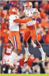  ?? JOHN BAZEMORE/ASSOCIATED PRESS ?? Clemson’s Deshaun Watson and Shaq Smith (5) celebrate the last-second touchdown that the Tigers used to stun Alabama.