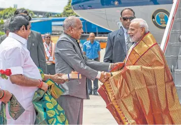  ?? AFP ?? India’s Primer Minister Narendra Modi, right, arrives in Chennai, ahead of a summit with Chinese President Xi Jinping to be held at the World Heritage Site of Mahabalipu­ram until tomorrow in Tamil Nadu state.